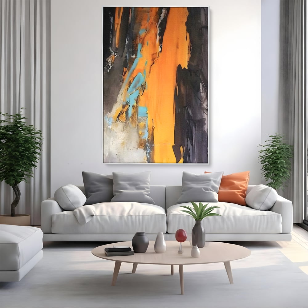 Tablou canvas cu pictura abstracta cu pete portocalii, in rama de aluminiu argintiu, pe perete intr-un living